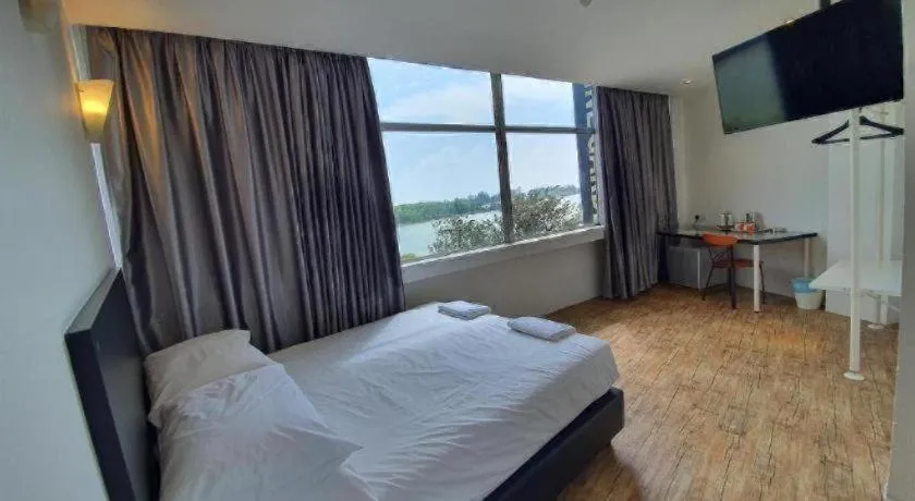 Bed in Riverine Garden Hotel