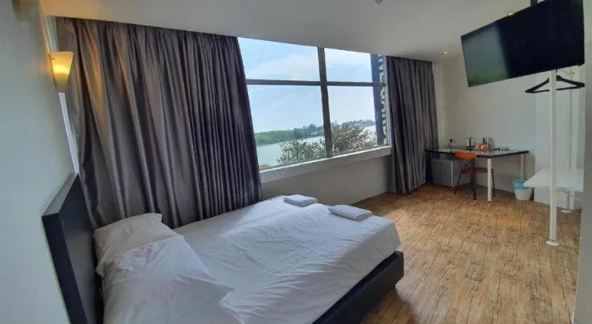 Bed in Riverine Garden Hotel