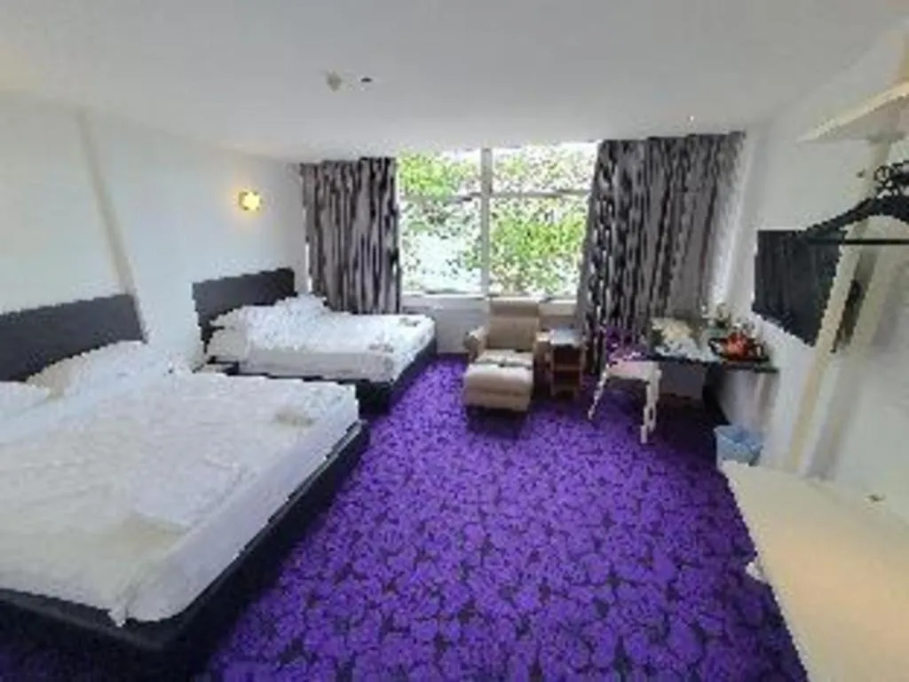 Bed in Riverine Garden Hotel