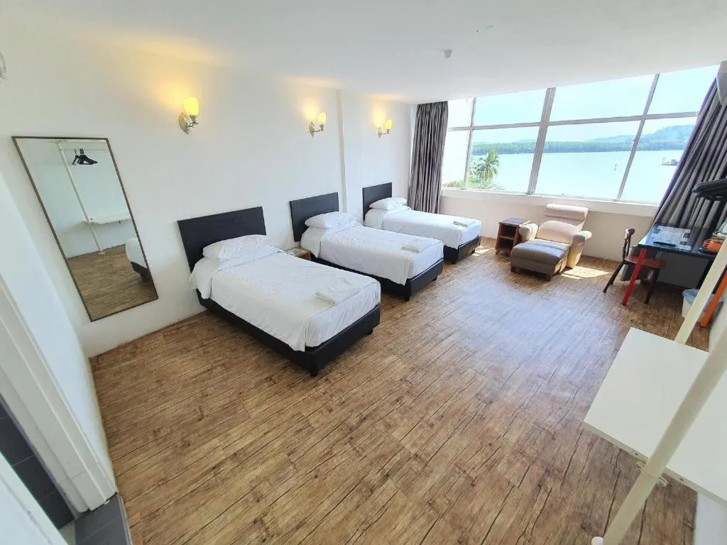 Bed in Riverine Garden Hotel