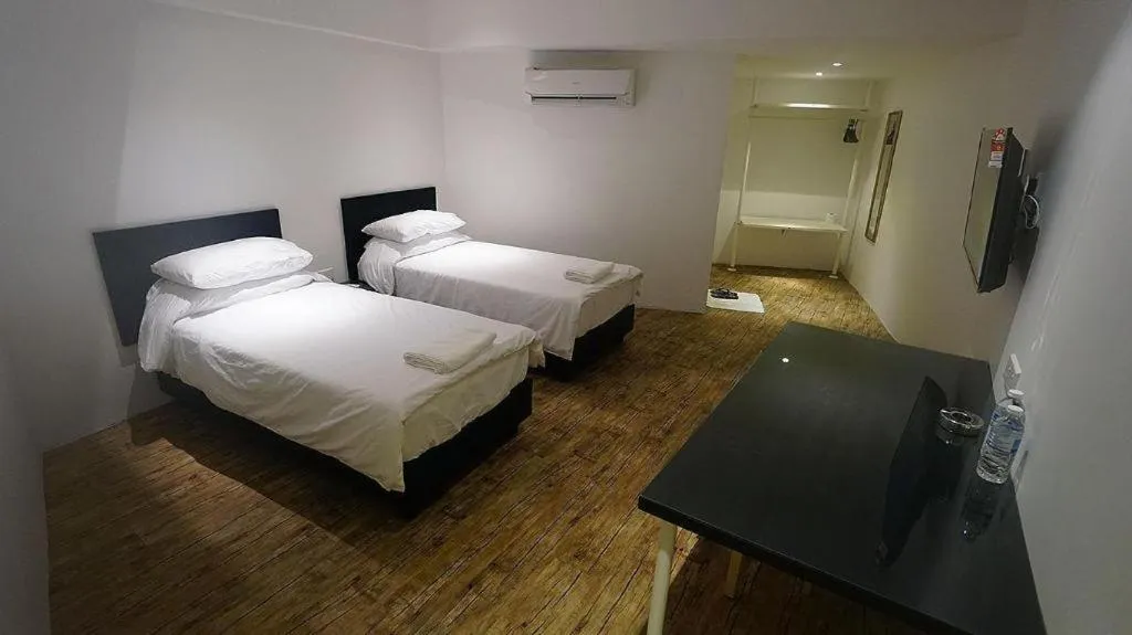 Bed in Riverine Garden Hotel