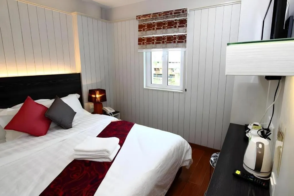 Bed in Grand SH Hotel