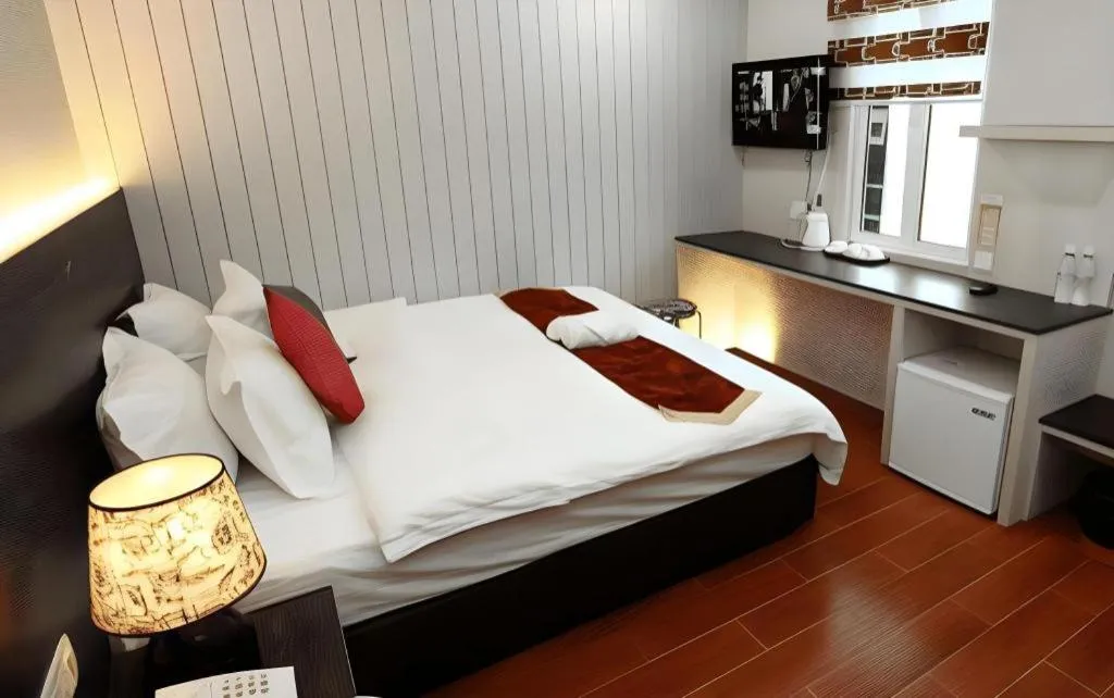 Bed in Grand SH Hotel