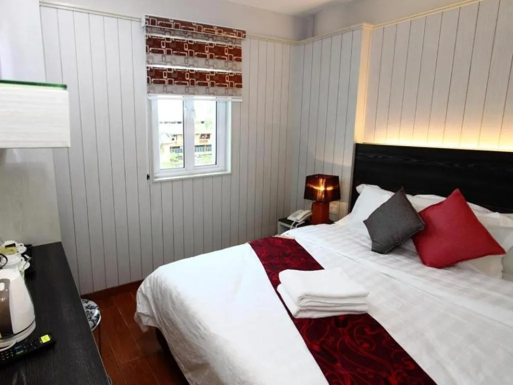 Bed in Grand SH Hotel