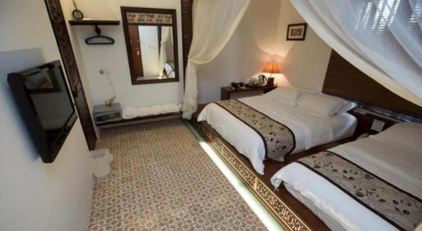 Bed in Courtyard at Heeren Boutique Hotel