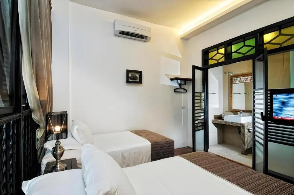 Bed in Courtyard at Heeren Boutique Hotel