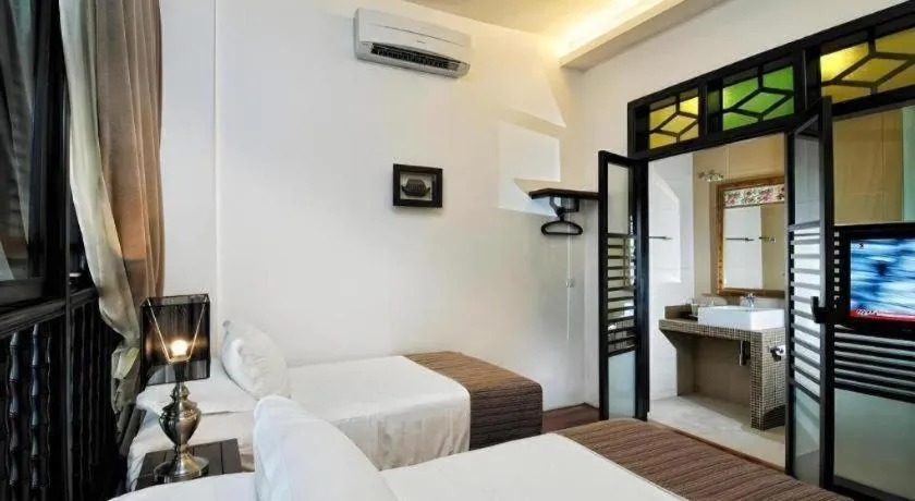 Bed in Courtyard at Heeren Boutique Hotel