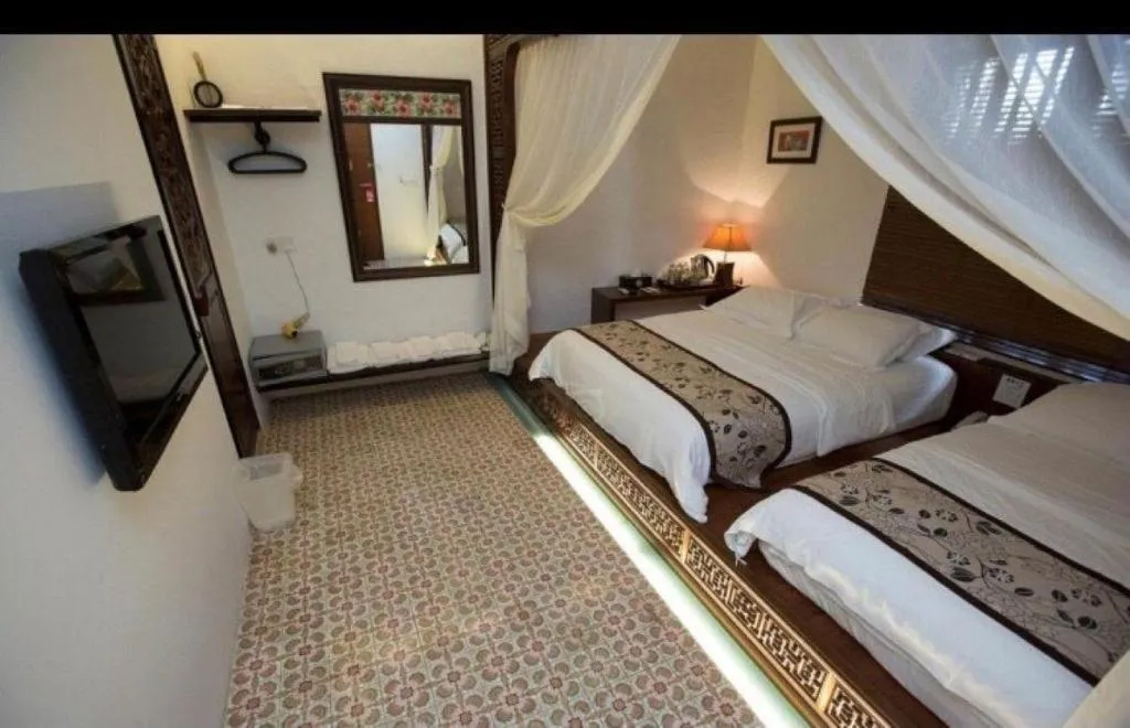 Bed in Courtyard at Heeren Boutique Hotel