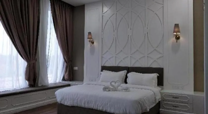 Bed in M GLOBAL HOTEL