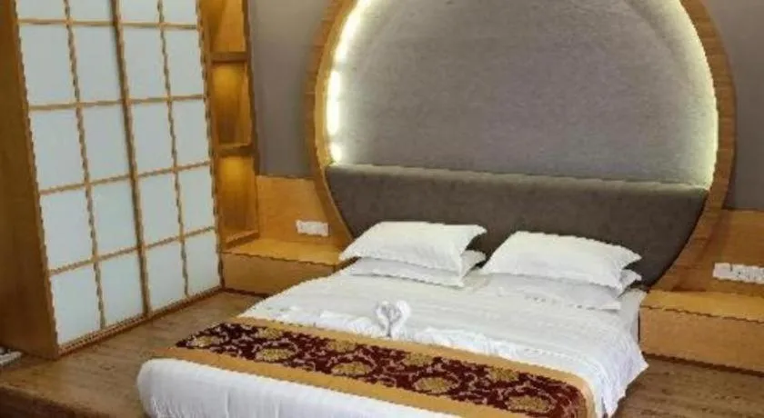 Bed in M GLOBAL HOTEL