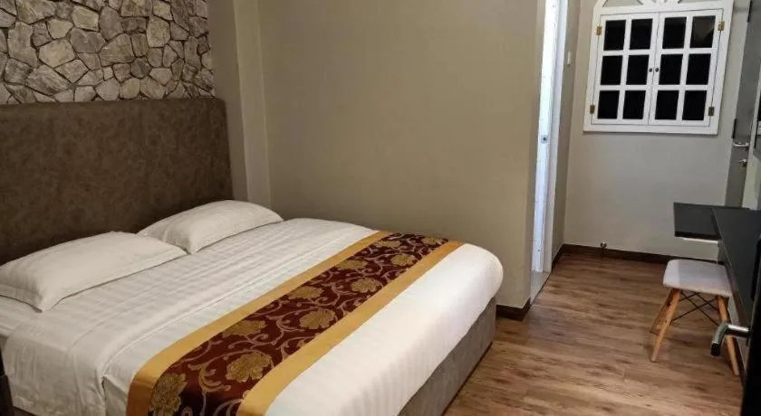 Bed in M GLOBAL HOTEL