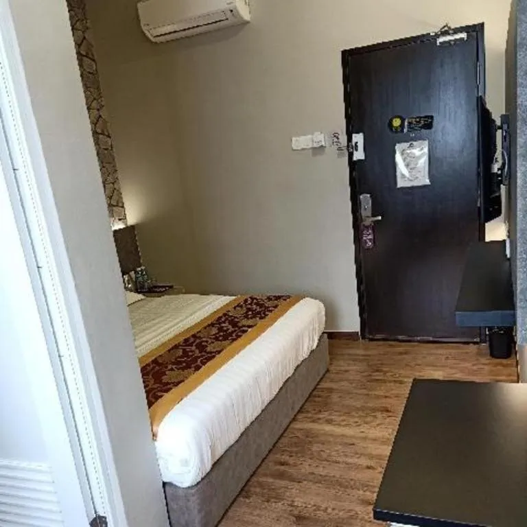 Bed in M GLOBAL HOTEL