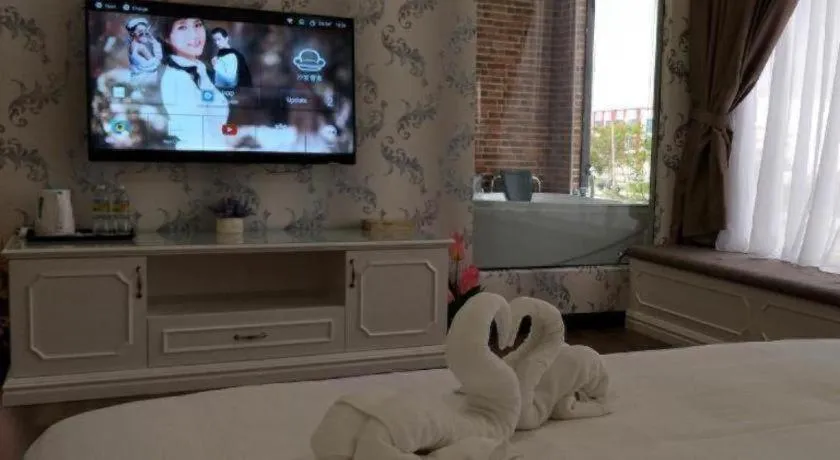 Bed in M GLOBAL HOTEL