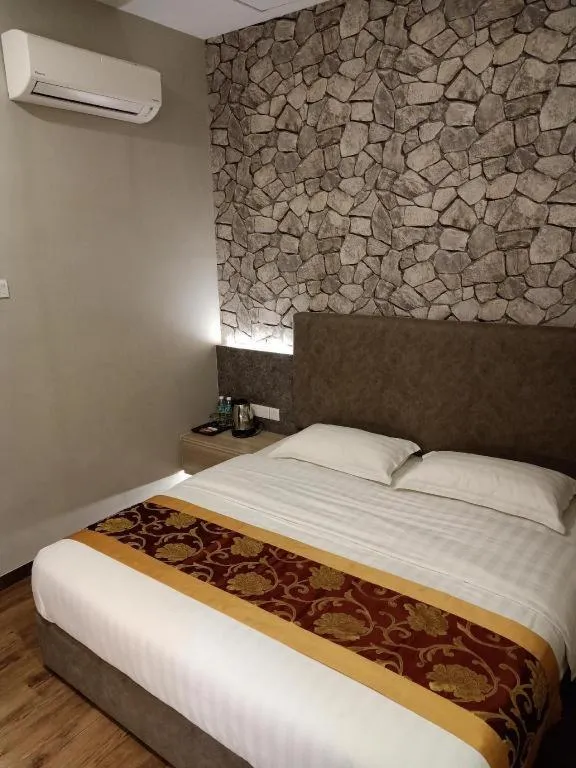 Bed in M GLOBAL HOTEL