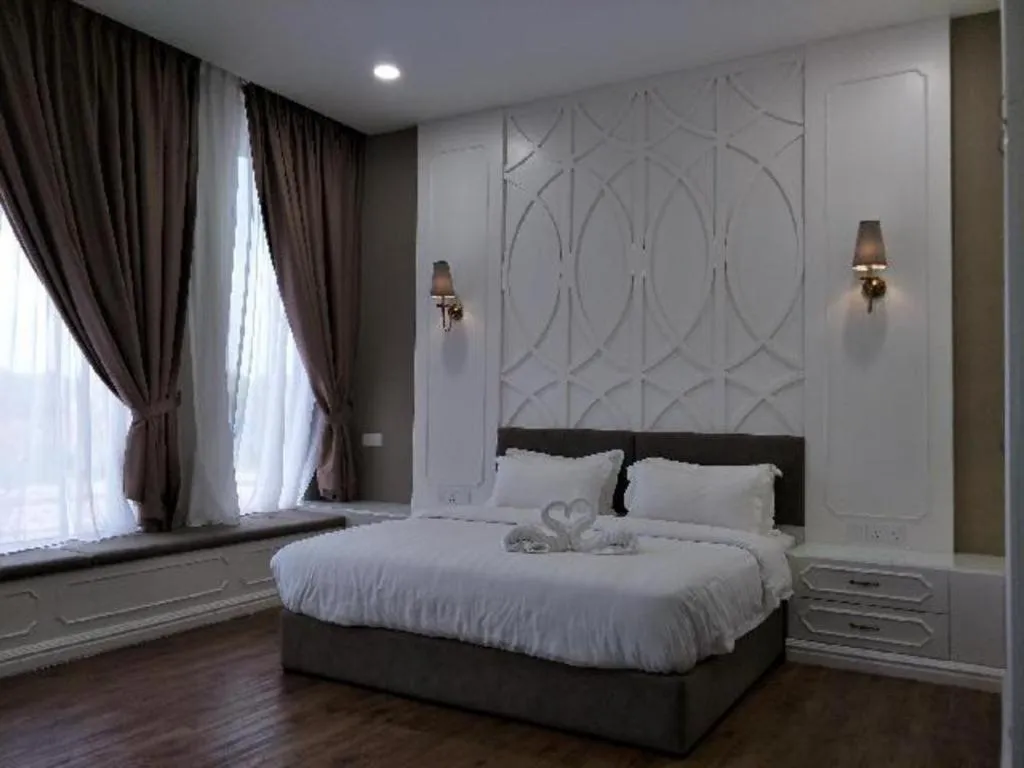 Bed in M GLOBAL HOTEL