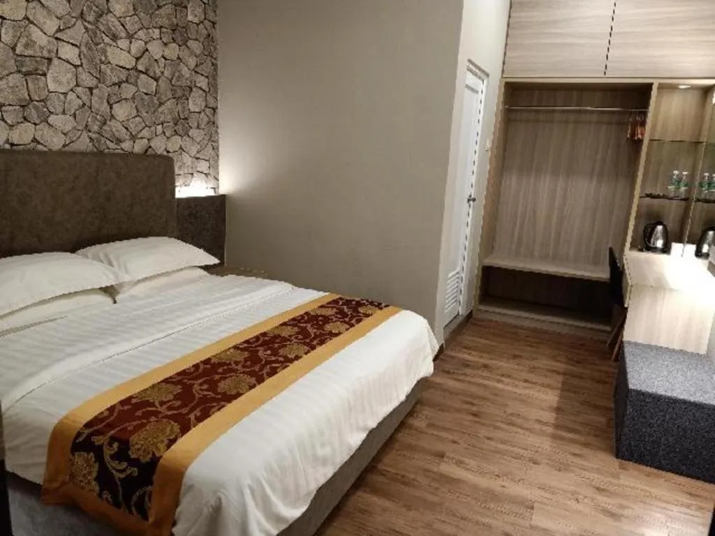 Bed in M GLOBAL HOTEL