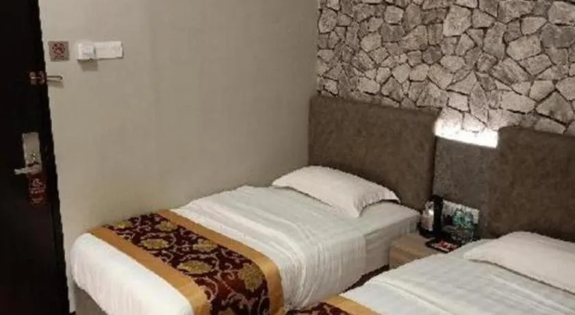 Bed in M GLOBAL HOTEL