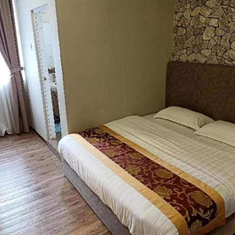 Bed in M GLOBAL HOTEL