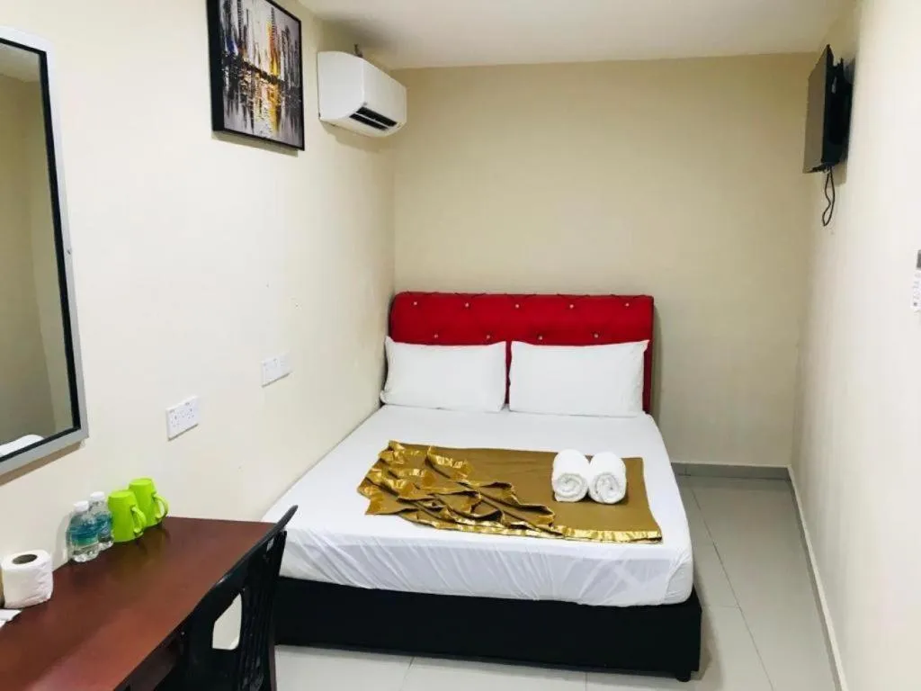 Bed in GEORGETOWN @ NEW WAVE HOTEL