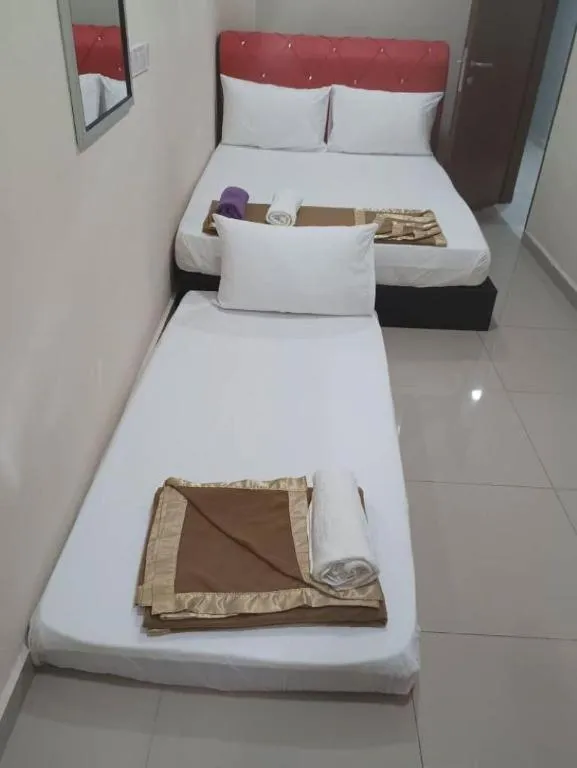 Bed in GEORGETOWN @ NEW WAVE HOTEL