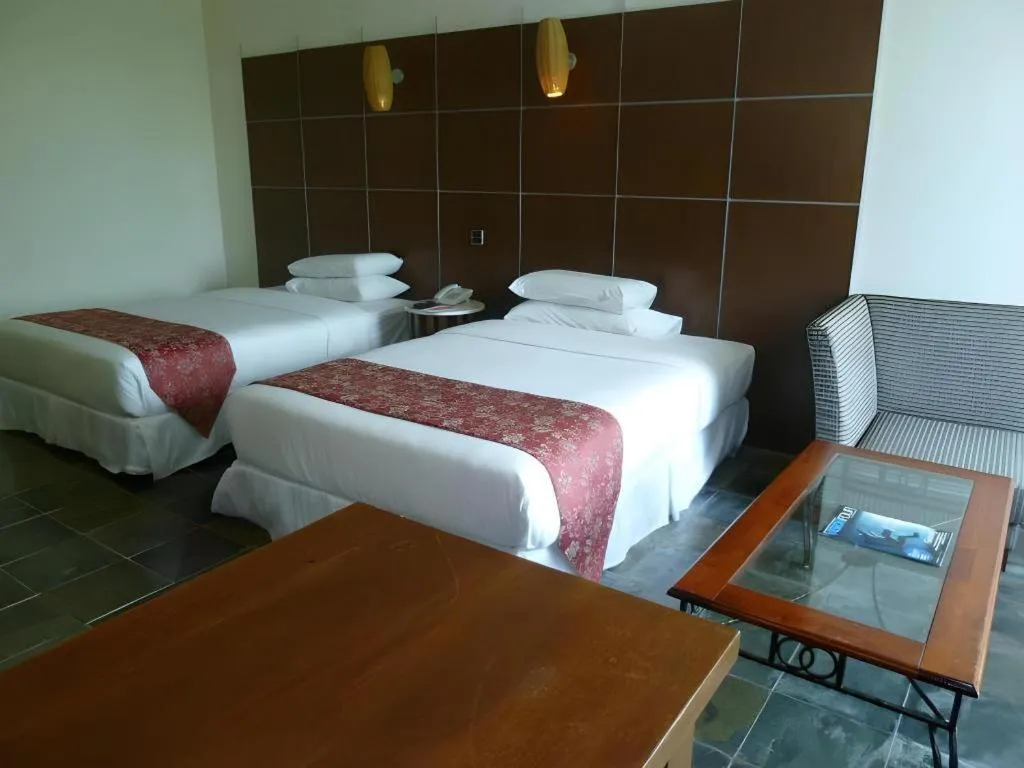 Bed in Century Helang Hotel