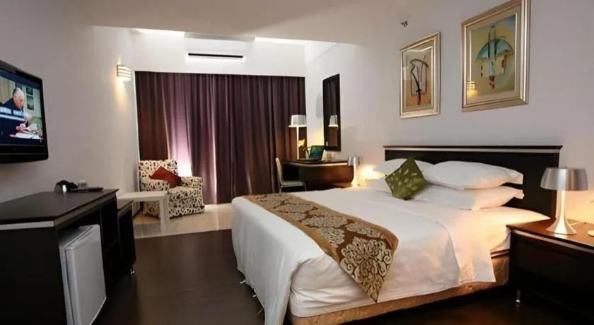 Bed in Ritz Garden Hotel