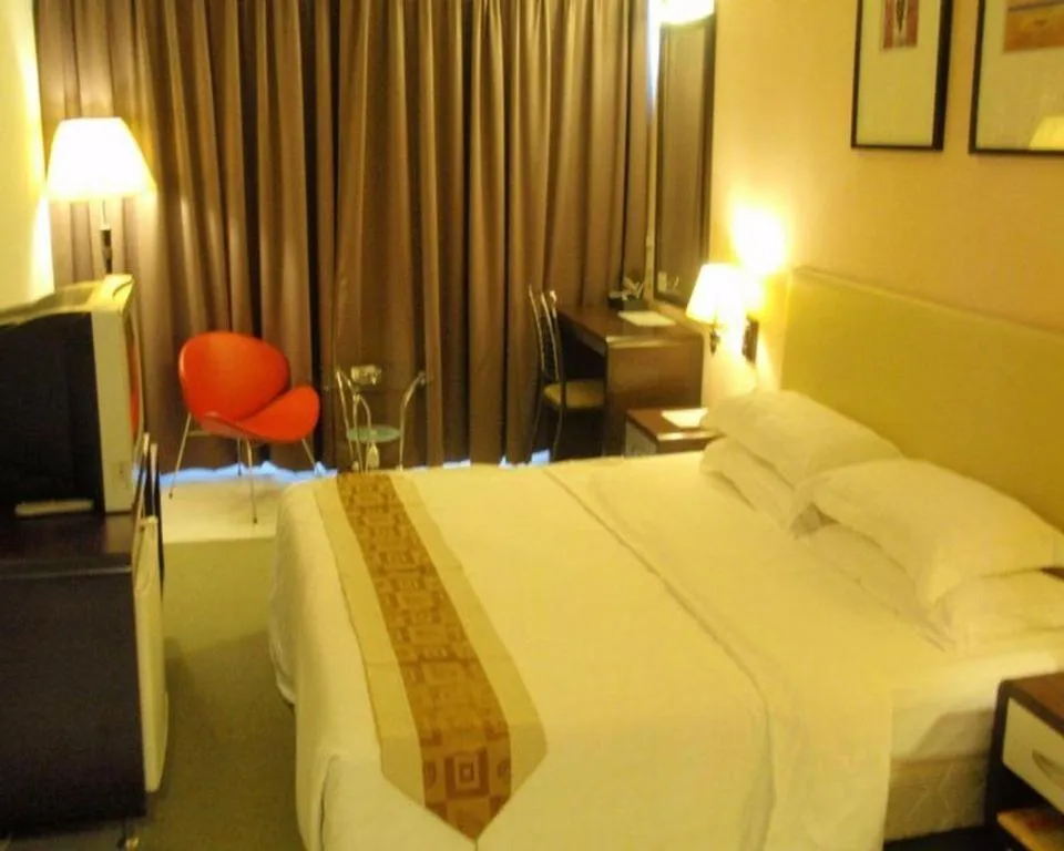 Bed in Ritz Garden Hotel