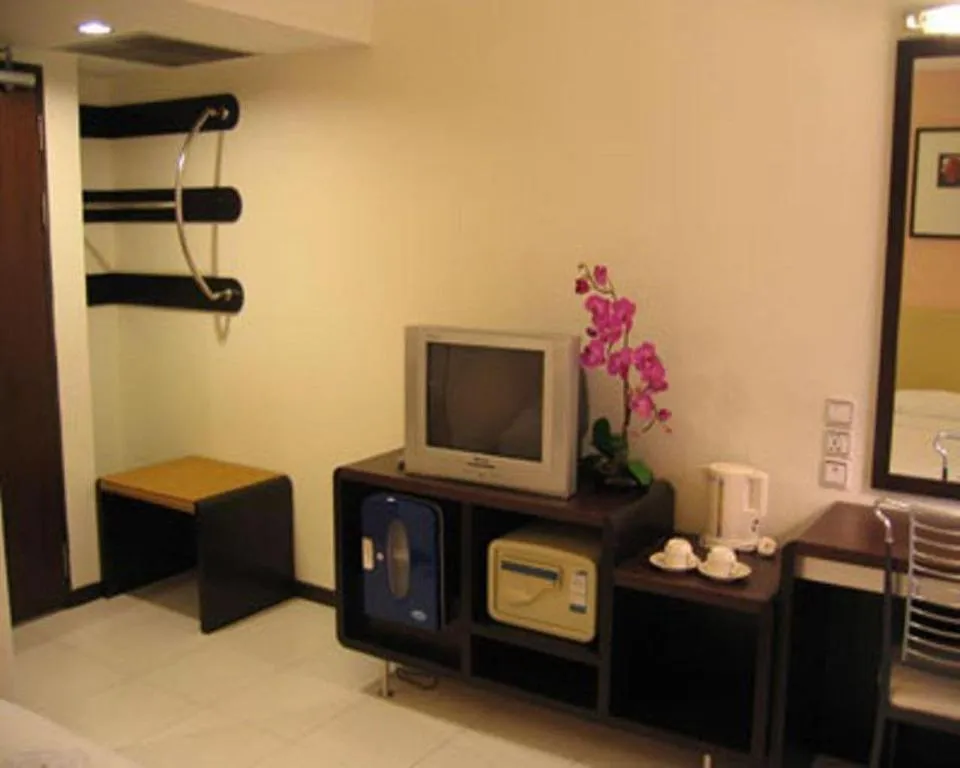 Bed in Ritz Garden Hotel