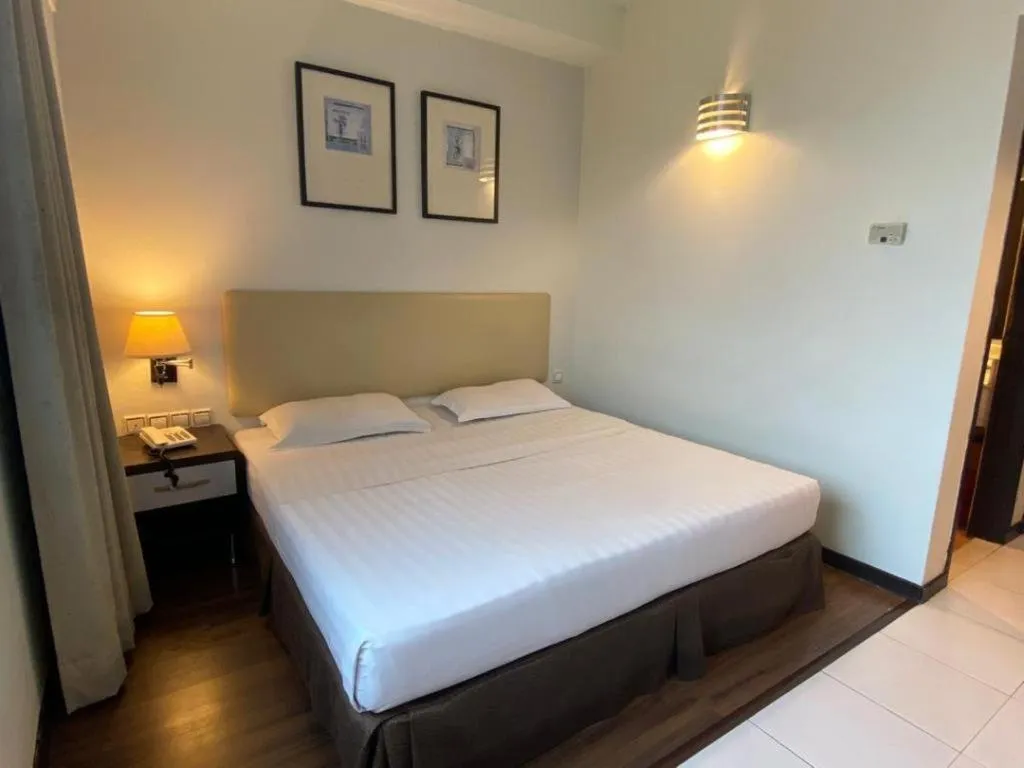 Bed in Ritz Garden Hotel