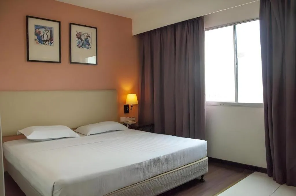 Bed in Ritz Garden Hotel