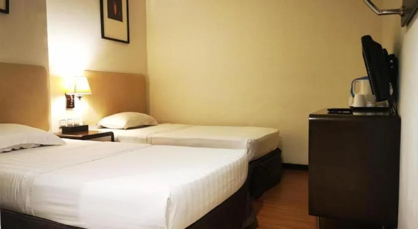 Bed in Ritz Garden Hotel