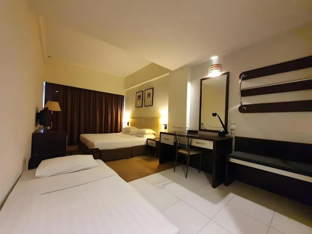 Bed in Ritz Garden Hotel