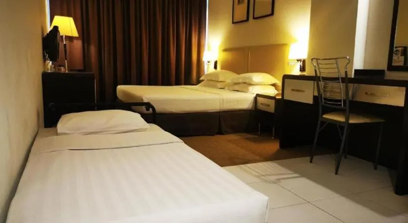 Bed in Ritz Garden Hotel