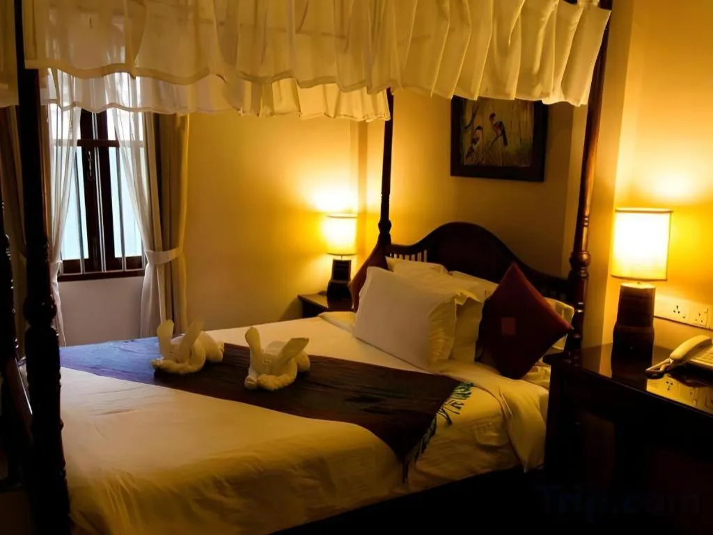 Bed in Anggun Boutique Hotel