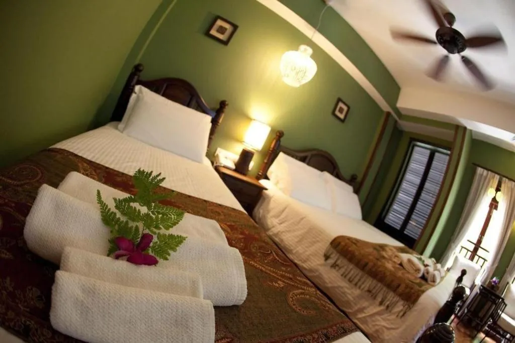 Bed in Anggun Boutique Hotel