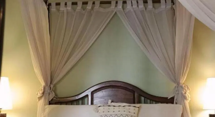 Bed in Anggun Boutique Hotel