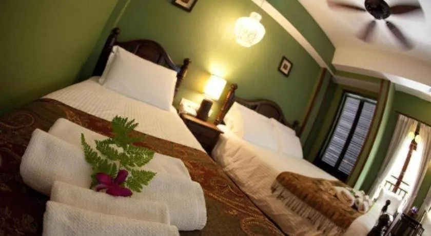 Bed in Anggun Boutique Hotel