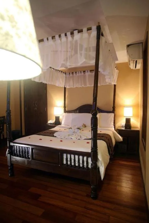 Bed in Anggun Boutique Hotel