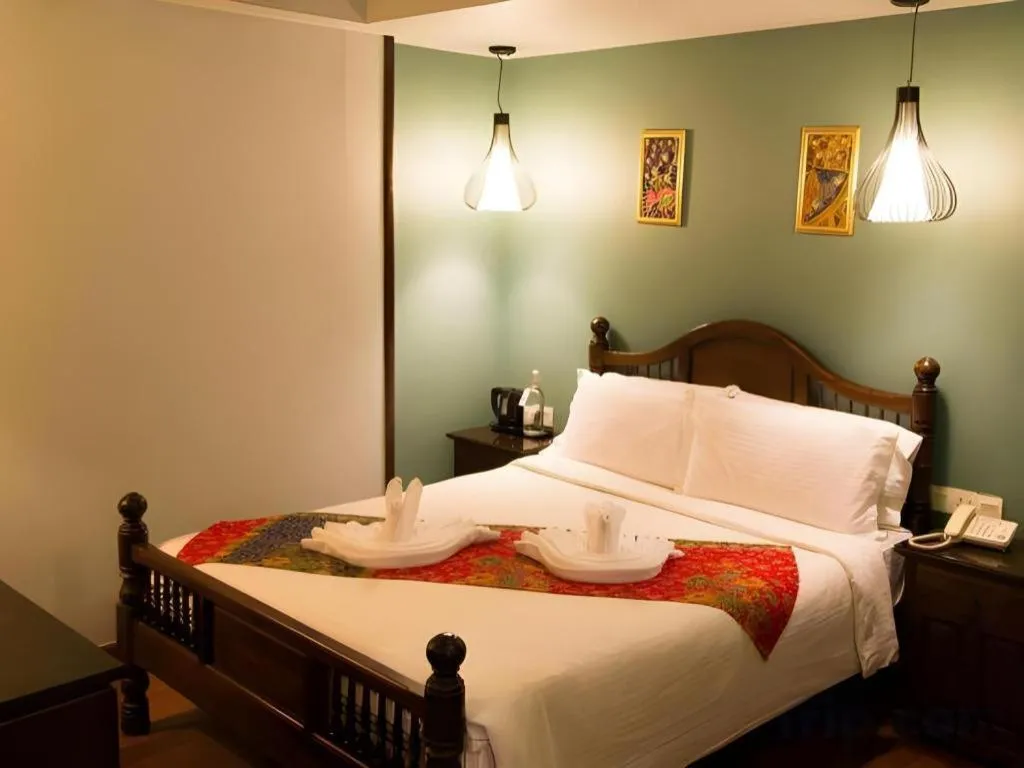 Bed in Anggun Boutique Hotel