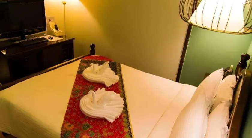 Bed in Anggun Boutique Hotel