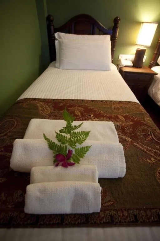 Bed in Anggun Boutique Hotel