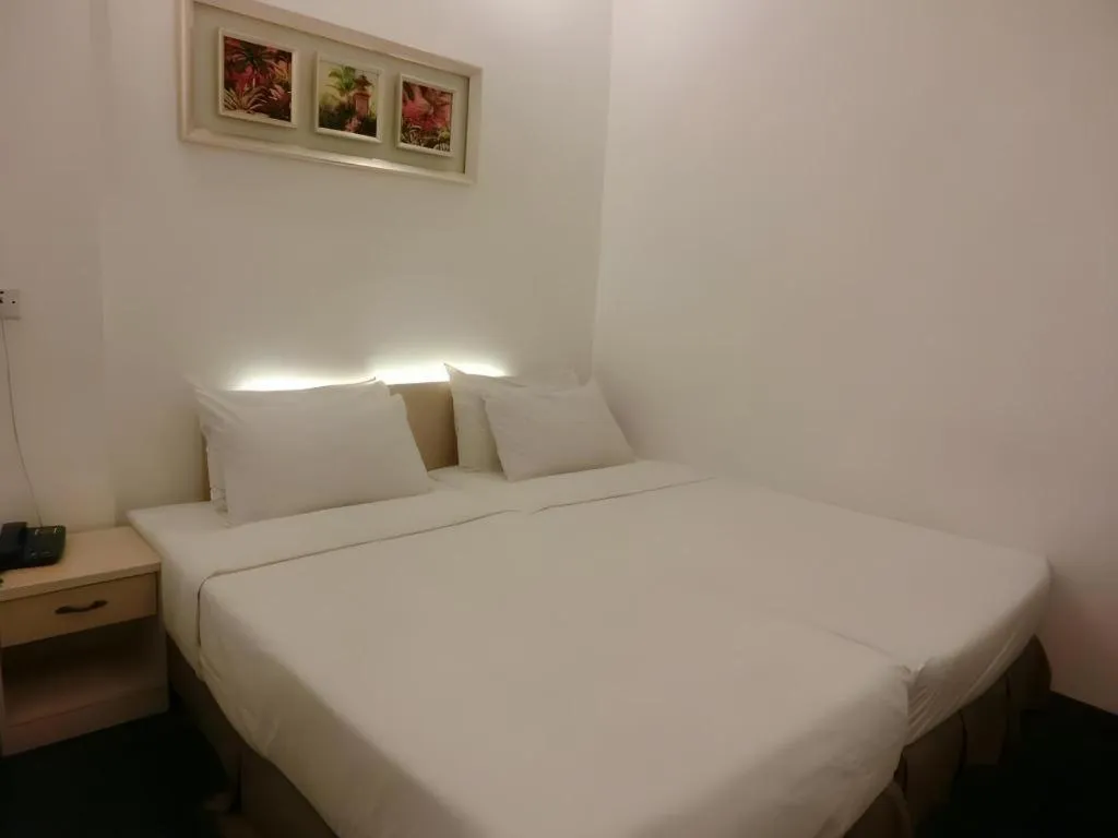 Bed in Paragon City Hotel