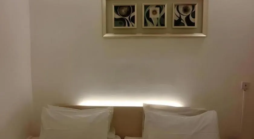 Bed in Paragon City Hotel