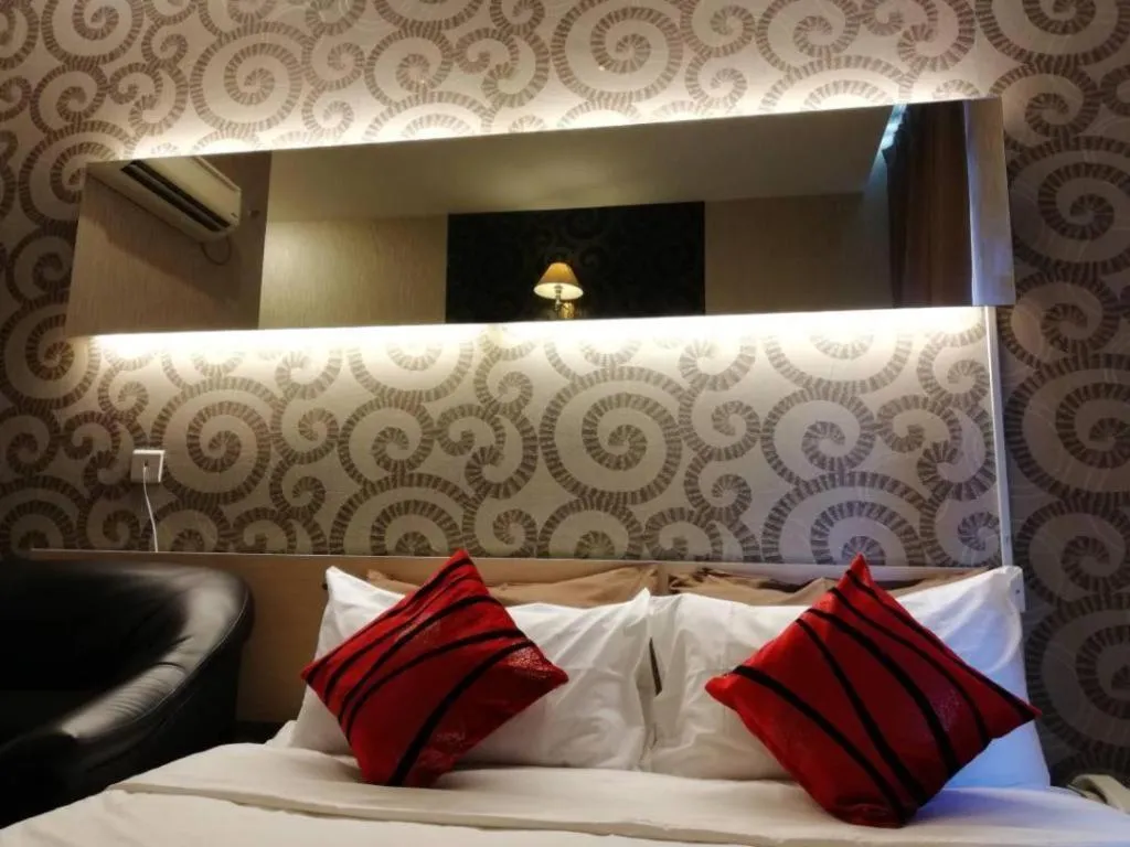 Bed in Paragon City Hotel
