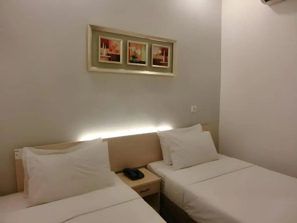 Bed in Paragon City Hotel