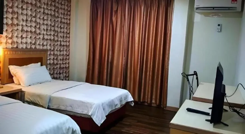 Bed in D'Borneo Hotel