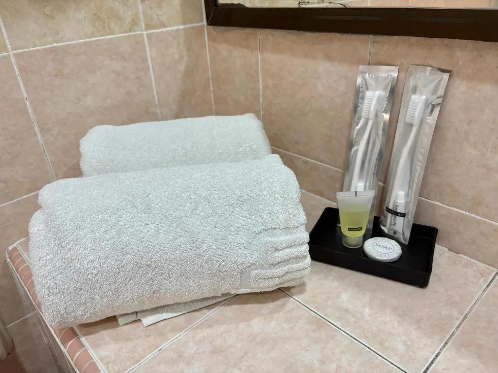 Bed in Putra Brasmana Hotel