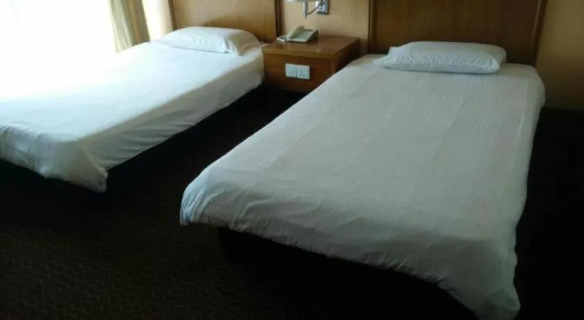 Bed in Putra Brasmana Hotel