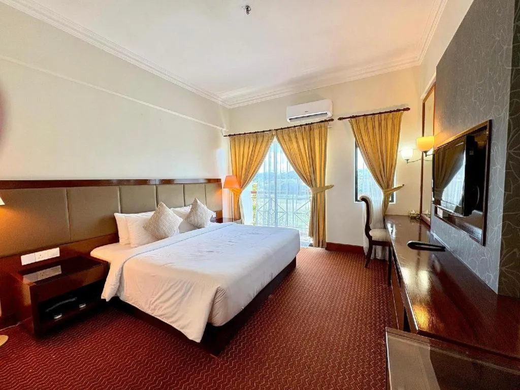 Bed in Putra Brasmana Hotel