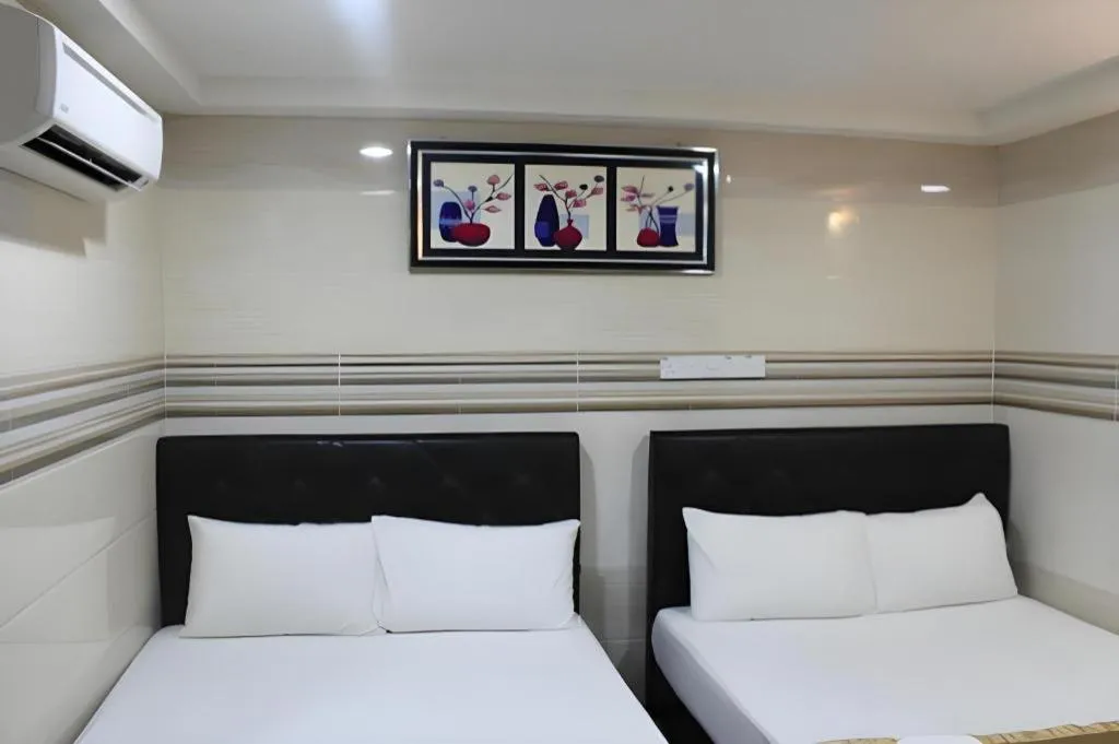 Bed in New Wave Hotel Melawati